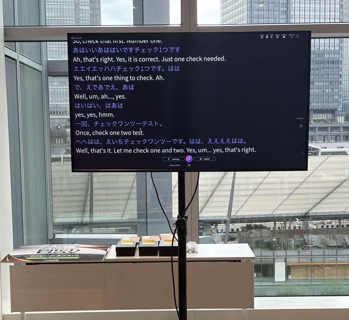The VoicePing translation screen at the event, showing the live transcript.